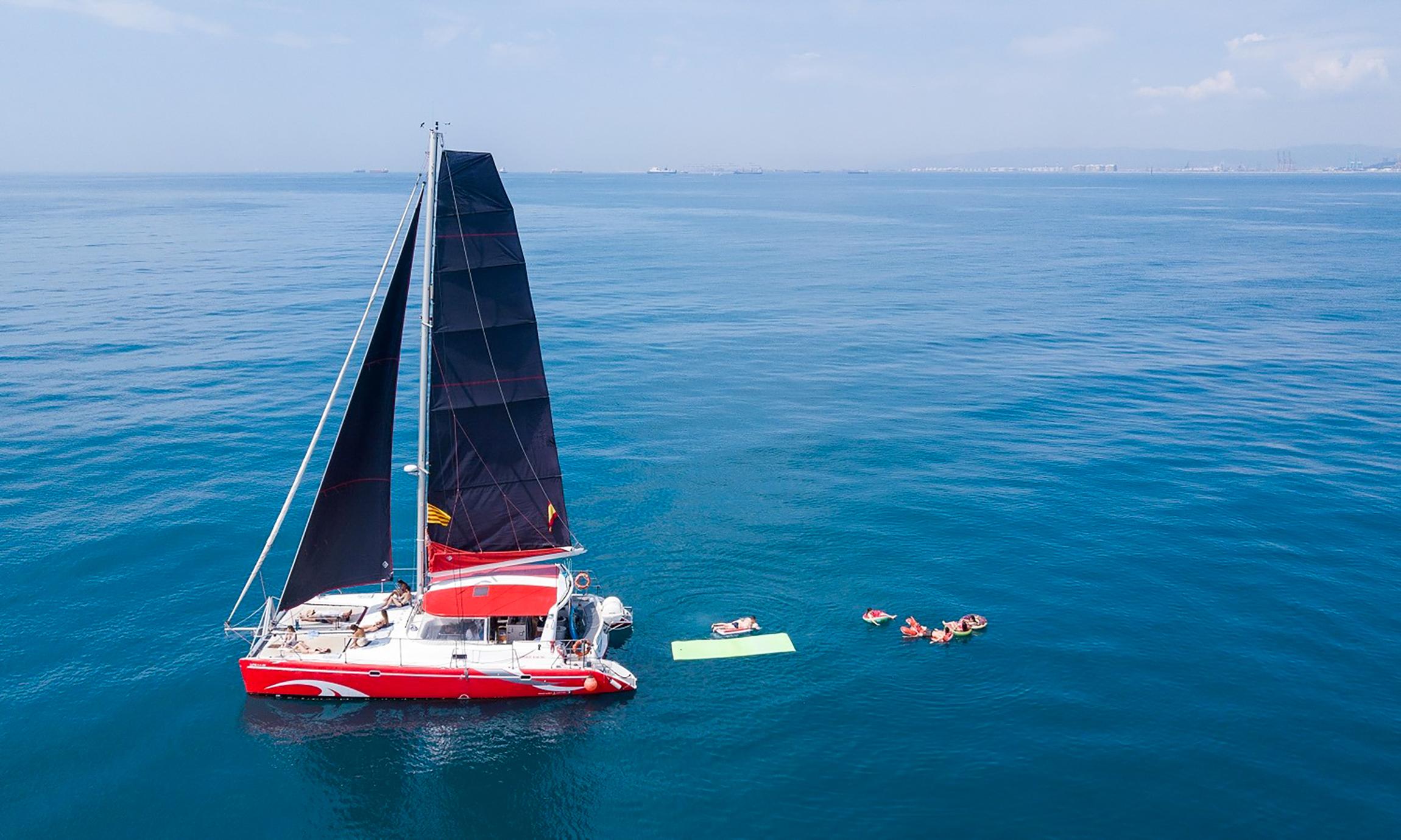 Sunset or Day Catamaran Cruise with Tapa & Drink